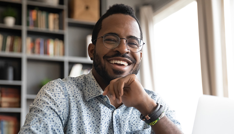 Student smiling with laptop