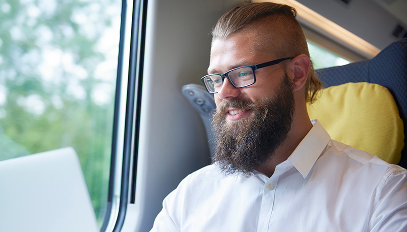 Student smiling with laptop