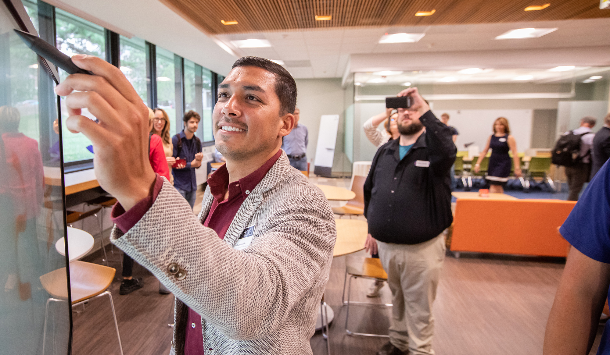 Man writing on interactive board