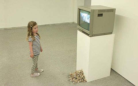 Young girl watching tv