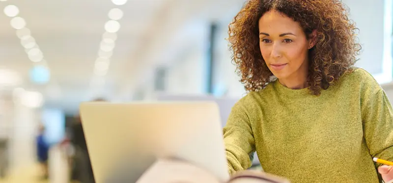 Female person looking at a computer